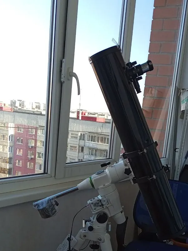 Sky-Watcher BK1149 on an equatorial mount, shooting from the balcony